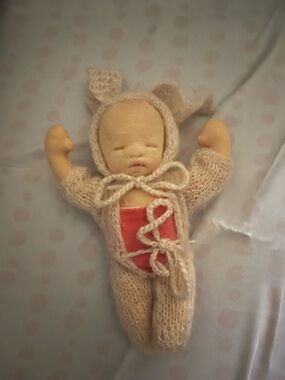 Handmade-Look Baby Doll in Cream Knit Outfit with Red Bodysuit